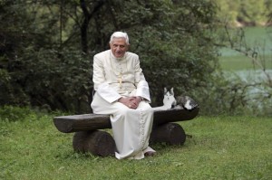 Our last Pope, "infallibly" hanging out with his pet cat.